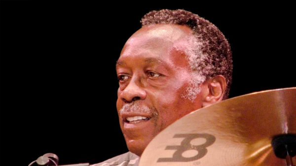 Former James Brown drummer Clyde Stubblefield sits behind his drums.