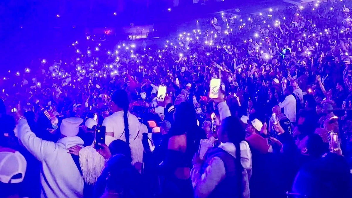 The audience is lit up by the glow of mobiles phones at the Meek Mill Philly homecoming concert