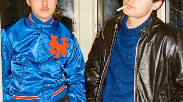 Rapper Judah West and producer IsoKeys standing next to each other inside a studio.