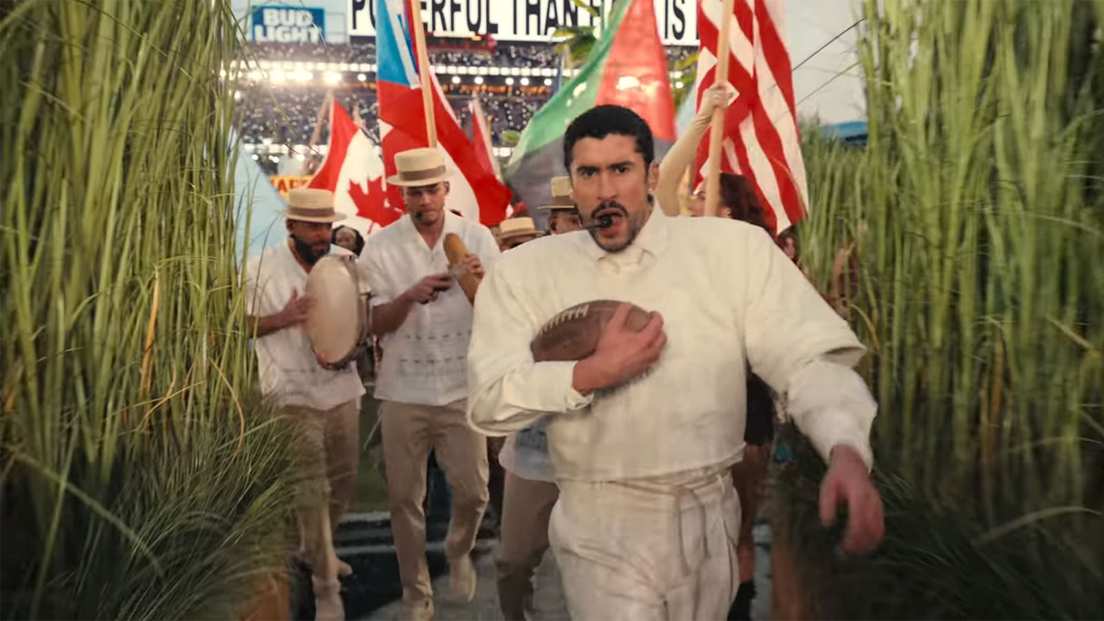 A flag of Canada is waved behind Bad Bunny during his Super Bowl halftime performance.