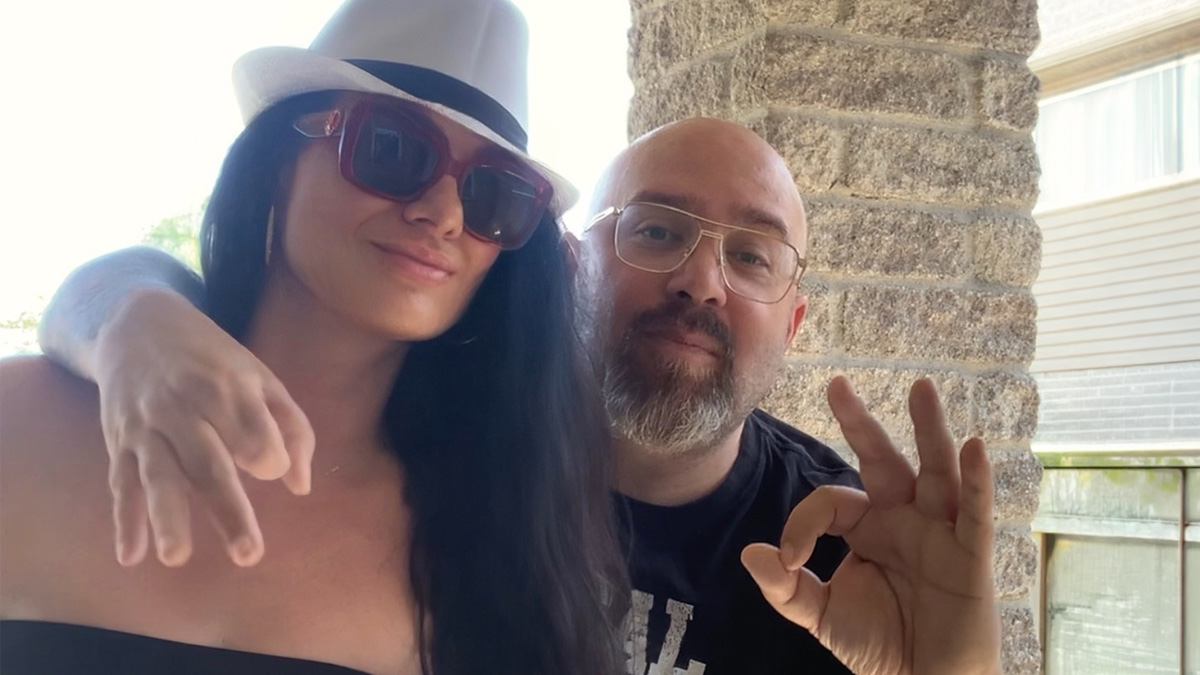 Melanie McVey poses for a photo with her partner Bishop Brigante