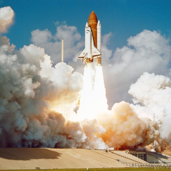 NASA rocket launch representing NASA plans to build a Moon base by the 2030s.