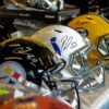 Autographed NFL helmets on display.