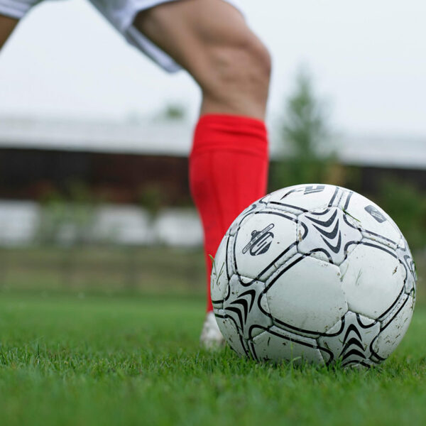 Canadian soccer player kicks a ball during a match ahead of the Canada 2026 World Cup team tournament on home soil.