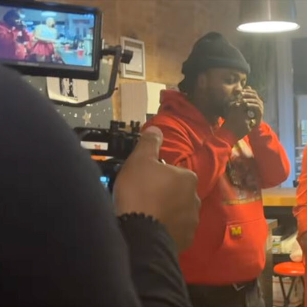 Price Da Boss lights a smoke in a scene from The Man Again music video.