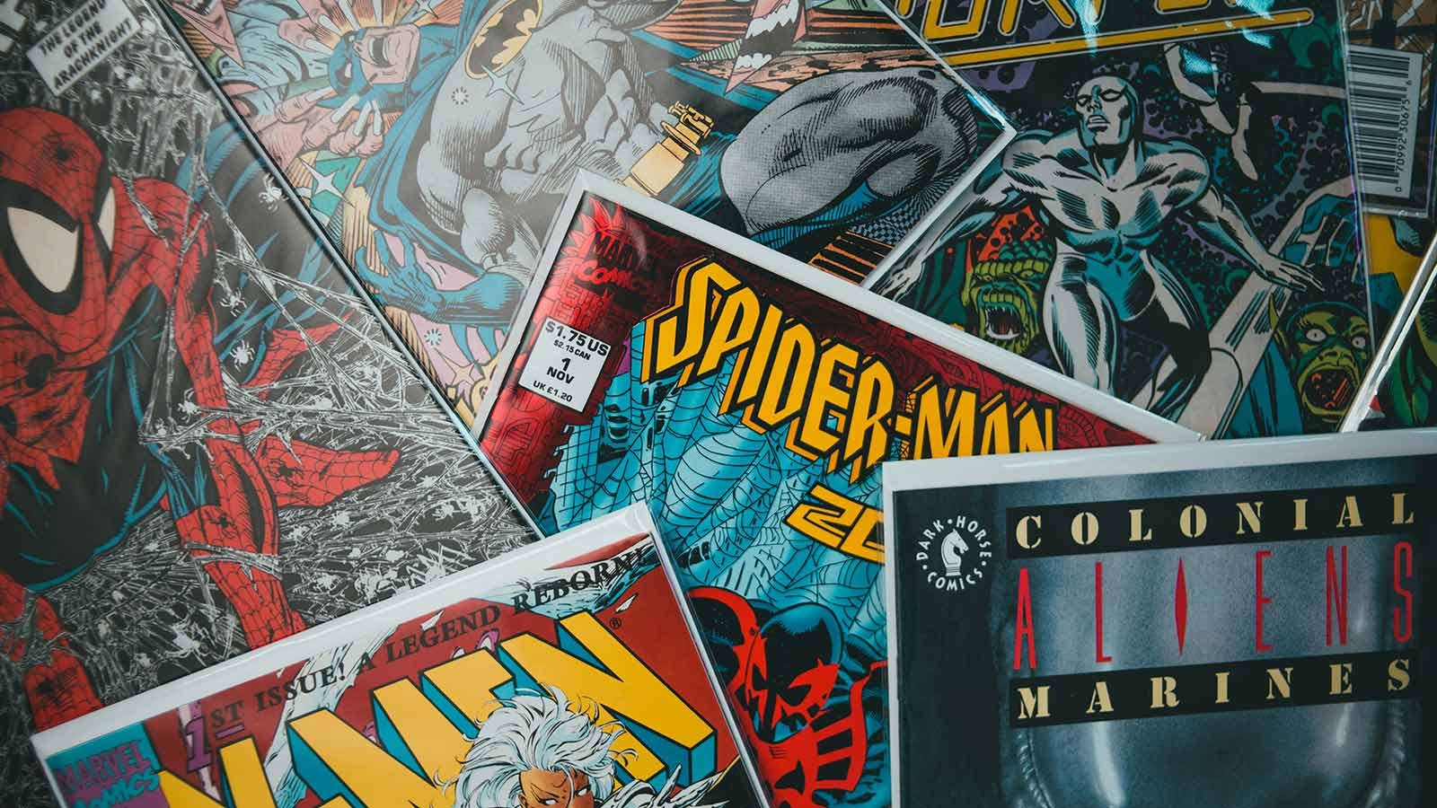 Vintage comic book covers displayed together, highlighting the rise of comics culture online and digital comics fandom.