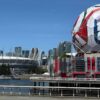 Iconic FIFA soccer ball and Vancouver stadium, showcasing urban sports architecture.