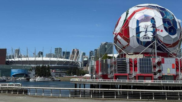 Iconic FIFA soccer ball and Vancouver stadium, showcasing urban sports architecture.