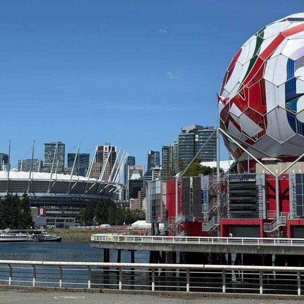 Iconic FIFA soccer ball and Vancouver stadium, showcasing urban sports architecture.