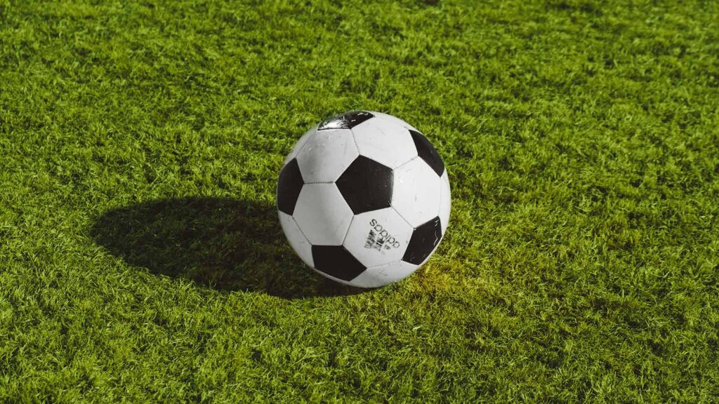 A soccer ball on a soccer field.