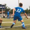 Players compete during a community pickup soccer match, an example of grassroots soccer in Canada.