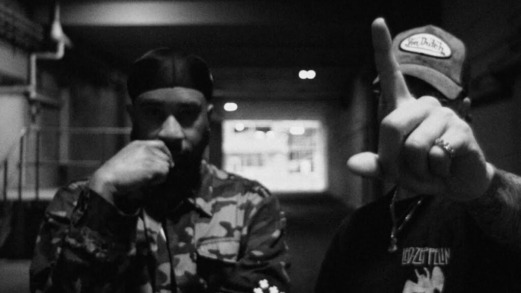 A black and white Sunna 2 promotional photo of rappers Tona and Sayzee.