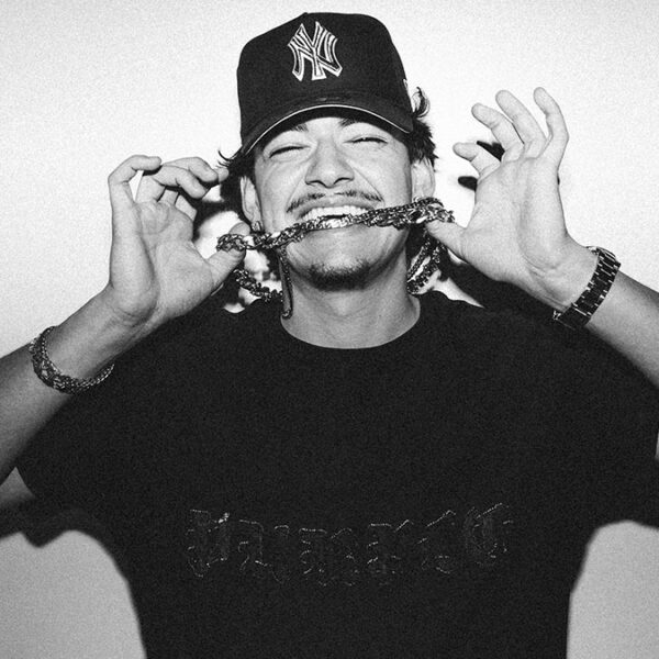 Ottawa rapper Taz Bentii bites the chain hanging around his neck.